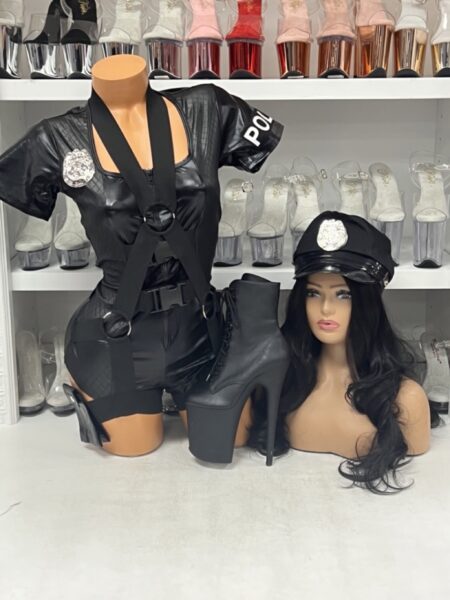 Model in Flirty Five-O police costume with romper, badge, and hat.