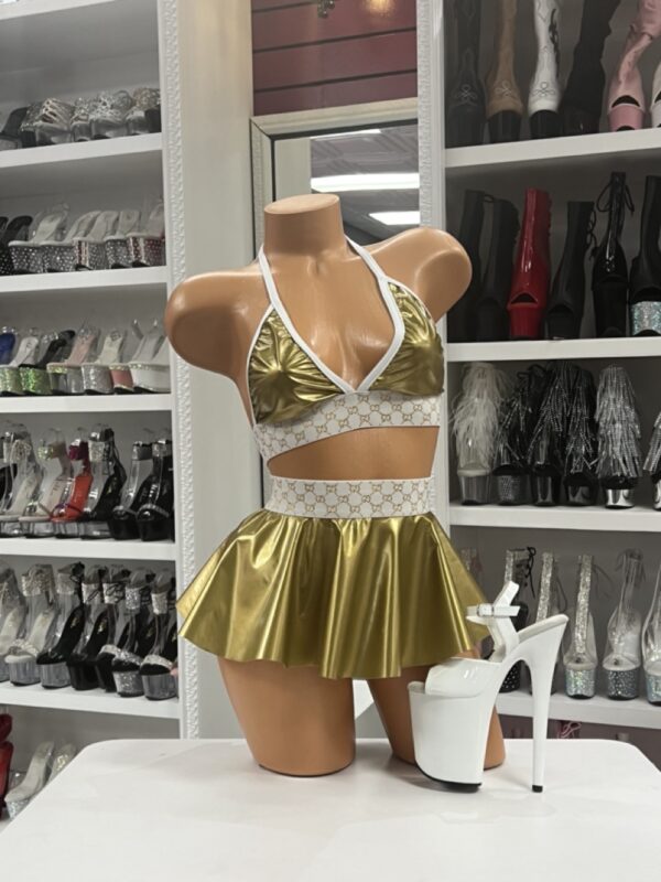 Gold metallic skirt set with white designer logo bands and triangle top