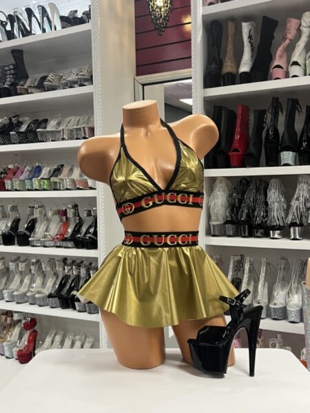Gold metallic designer inspired skirt set with logo trim and halter top