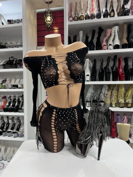 Black fishnet off-shoulder set with rhinestone studded lace-up details front view