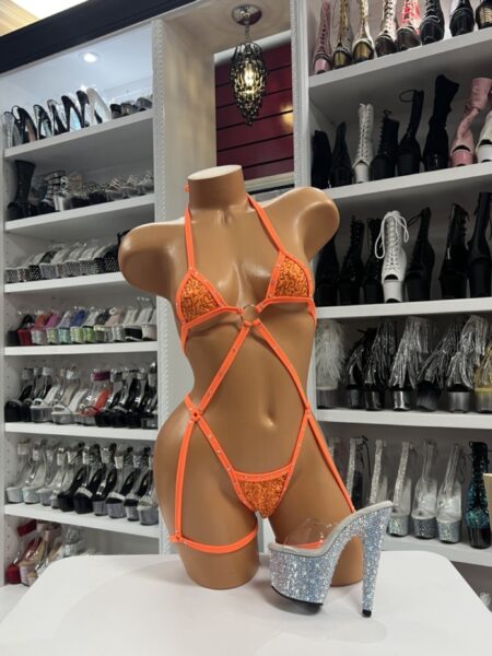 Orange sequin and rhinestone strappy romper with crisscross body harness design