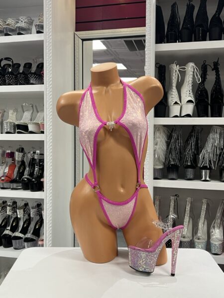 Pink shimmer slingshot bodysuit with rhinestone connectors and hot pink trim