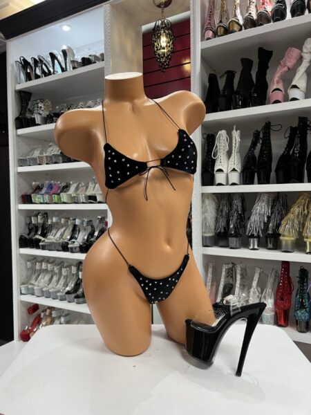 Black rhinestone bikini set with adjustable string ties displayed on mannequin with black platform heels