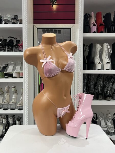 Baby pink rhinestone bikini with bow details on mannequin and pink platform heels