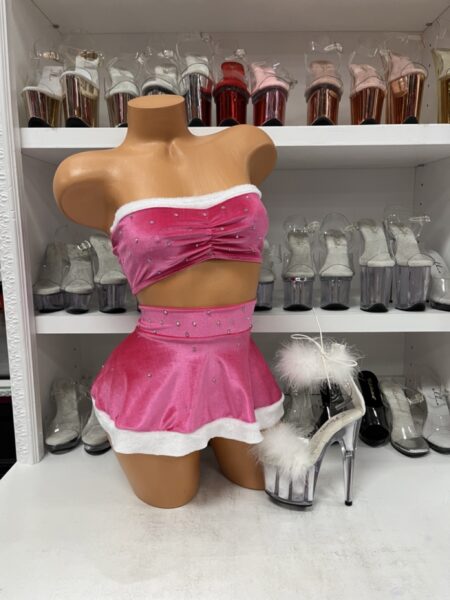“Pink velvet rhinestone skirt set with bandeau top and white trim”