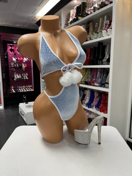 “Light blue velvet rhinestone monokini with white trim and pom-poms”