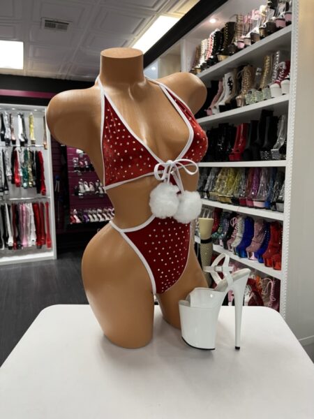 “Red velvet rhinestone monokini with white trim and pom-poms, shoes not included”