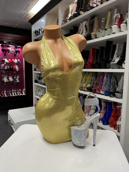 Gold halter rhinestone mini dress with deep V neckline on mannequin
