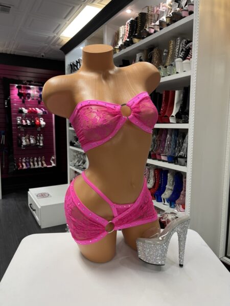 Pink lace two-piece set with strapless top, mini skirt, and ring details