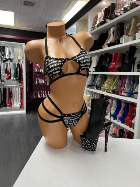 “Black strappy graphic two-piece dance set with cutout design”