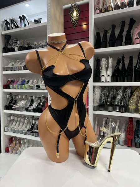 black chain harness performance bodysuit on mannequin