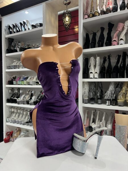 Purple velvet plunge mini dress with scalloped neckline on mannequin