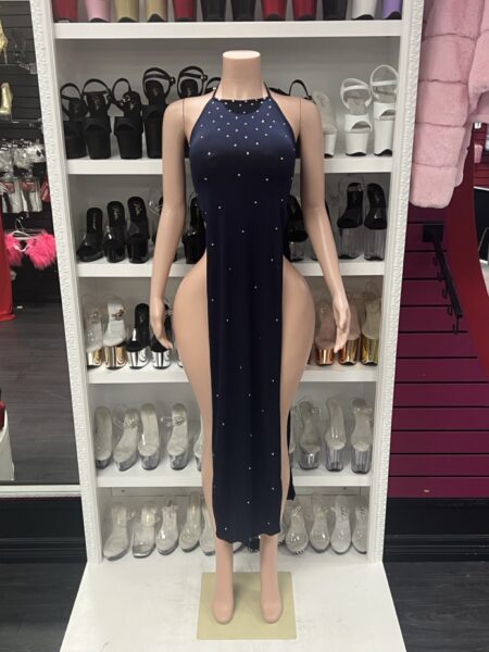 Navy blue halter rhinestone maxi dress with high side slits displayed on mannequin in boutique showroom