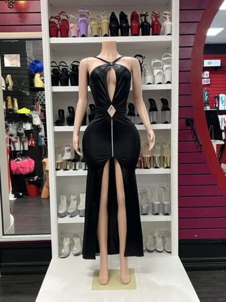 Black diamond keyhole gown with rhinestone waist accent and front slit on mannequin