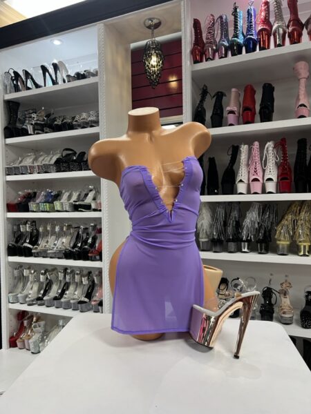 Lavender lace-up mini dress with strapless neckline and fitted silhouette on display mannequin