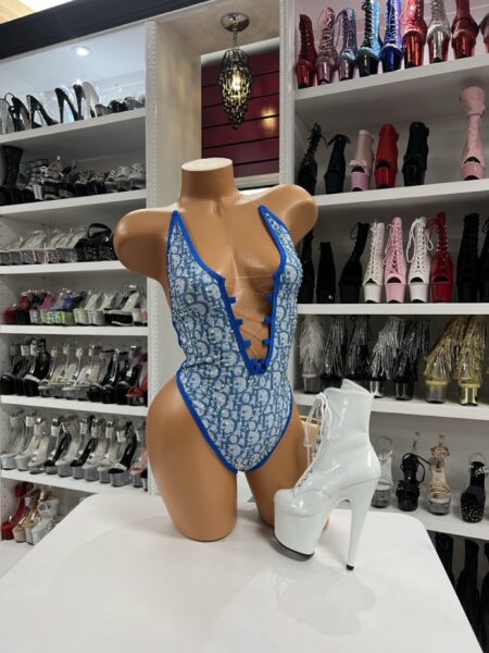 Aqua nova plunge bodysuit with crystal detailing and lace-up front displayed on mannequin