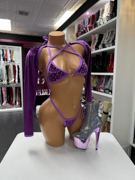 Amethyst crystal strap performance set with purple multi-strap design and arm sleeves on mannequin