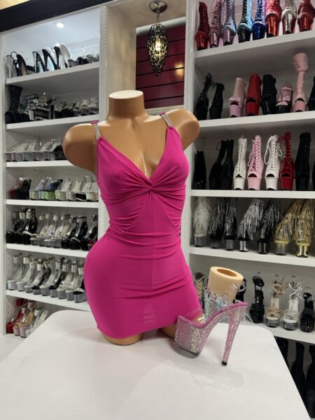 Hot pink rhinestone dress with crystal straps displayed on mannequin