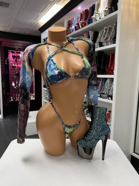 Model wearing galaxy slingshot rhinestone bodysuit with long mesh sleeves and adjustable straps