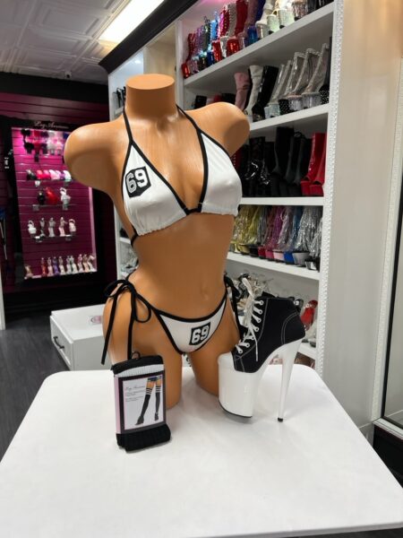 Sporty number bikini set with black trim and adjustable halter top displayed on mannequin