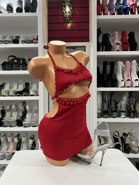 Red pom trim cutout mini dress displayed on mannequin