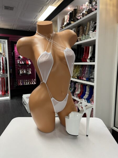 White slingshot bikini set featuring crisscross neck straps and minimal coverage for bold stage presence. Lightweight stretch fabric supports comfortable movement and confident performance.
