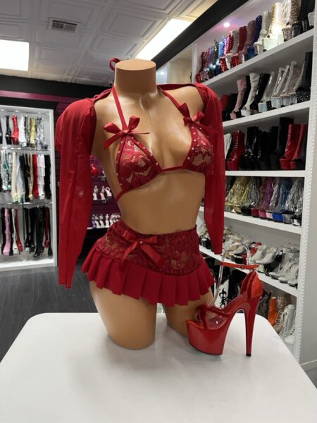 Crimson lace bow lingerie set with ruffle skirt and mesh sleeves displayed on mannequin