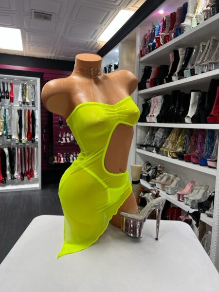 Model wearing Neon Yellow Cutout Dress with sheer mesh side drape and open belly cutout design