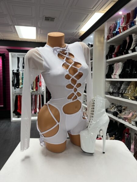 White lace up romper with long sheer sleeves and open waist cutouts