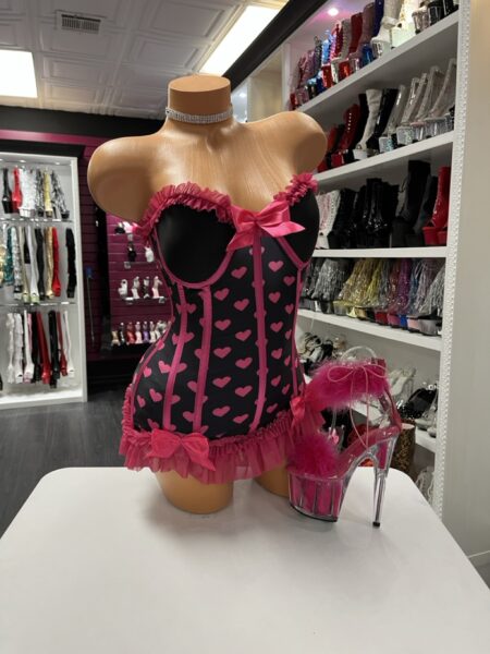 Alt text: Pink Heart Corset Dress front view with lace trim and bow accents