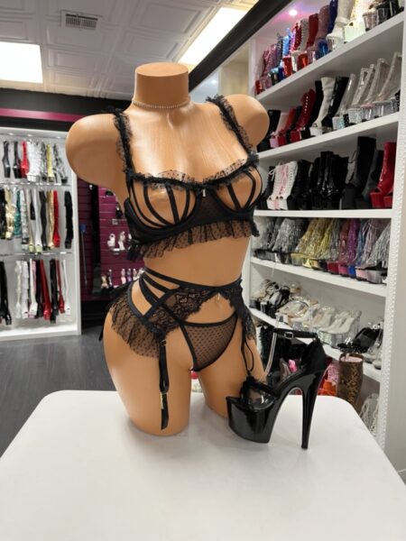 Black ruffle strap lingerie set with sheer mesh, lace details, and garter straps