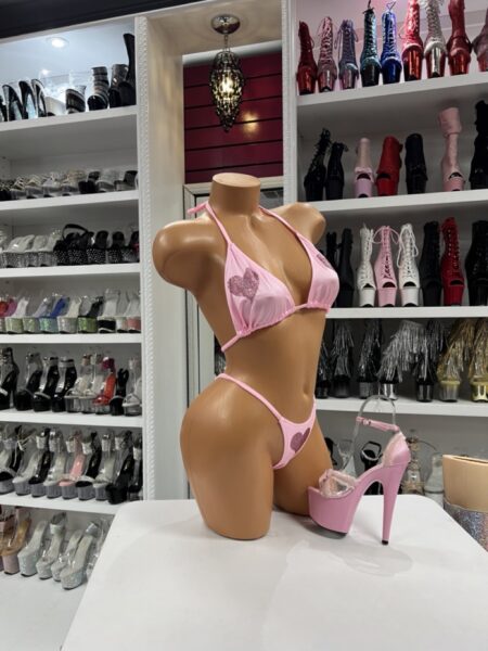 Model wearing blush heart rhinestone set with triangle halter top and minimal bottom