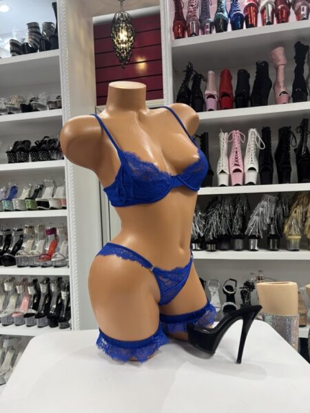 Model wearing royal blue lace set with underwire bra, thong, and lace leg garters
