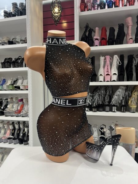 Model wearing midnight rhinestone mesh set with sheer crop top and mini skirt