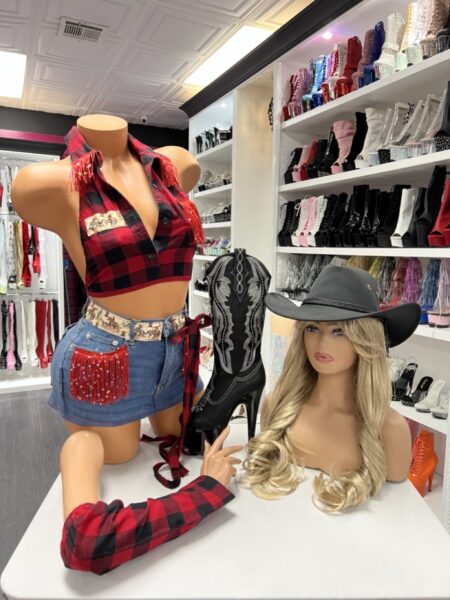Model wearing red buffalo fringe set with plaid halter top and rhinestone fringe denim skirt