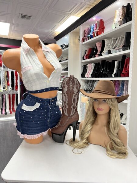 Model wearing rhinestone lace cowgirl set with plaid crop top and rhinestone denim shorts