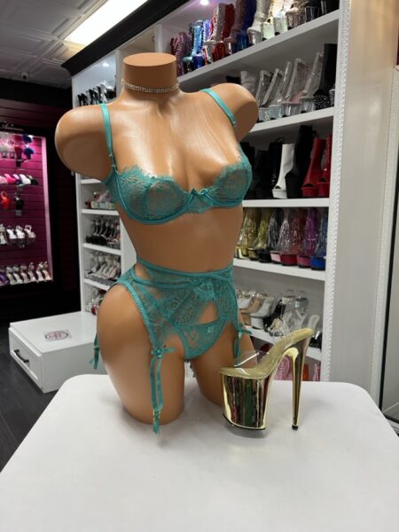 Teal lace garter set with underwire bra, high-cut bottoms, and adjustable straps