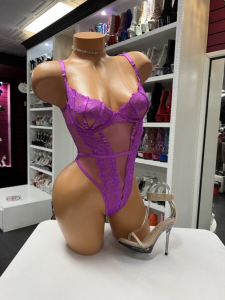 Fuchsia lace cutout bodysuit with sheer panels and strappy design