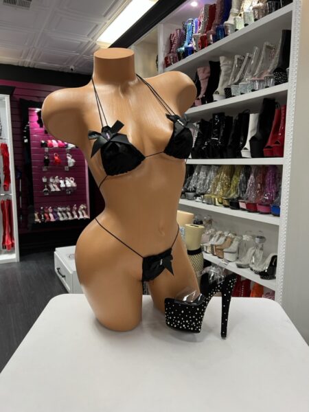 Black micro bikini set with satin bow details and minimal coverage thong