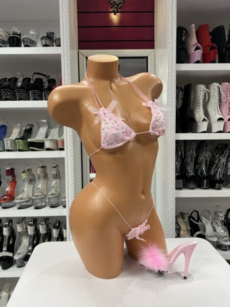 Baby pink lace thong bikini with bow accents and adjustable straps