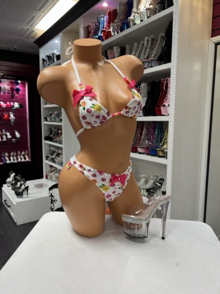 This floral bow beaded bikini blends playful prints with charming bow and bead details. Designed for a flattering fit with eye-catching accents.