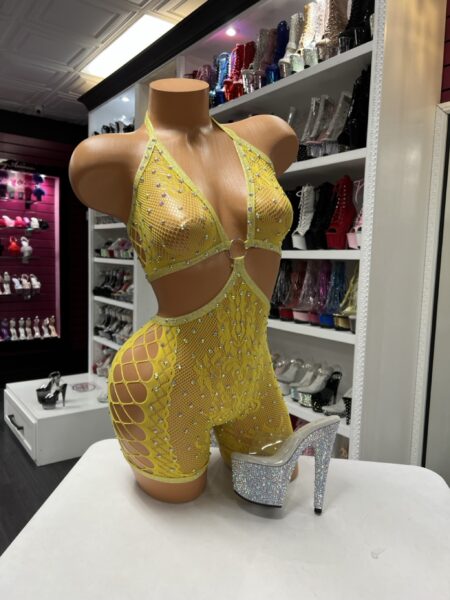Yellow fishnet romper with rhinestones, halter neckline, and ring front detail