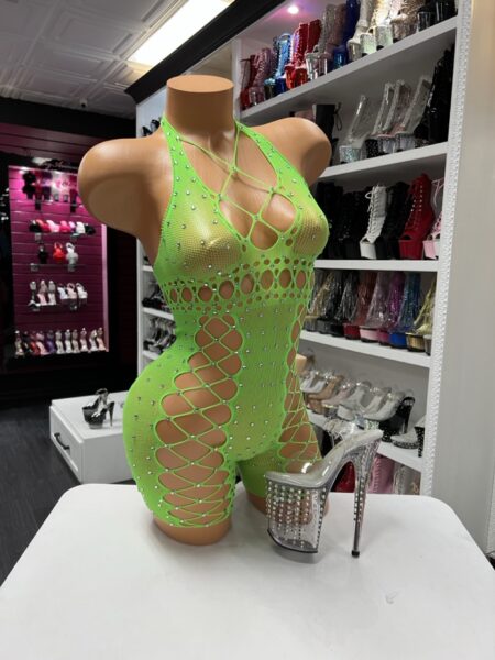 Neon green fishnet romper with rhinestones, halter neckline, and web-style front design