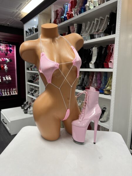 pink string micro romper thin strap design open silhouette minimal coverage stretchy fabric fitted bold outfit