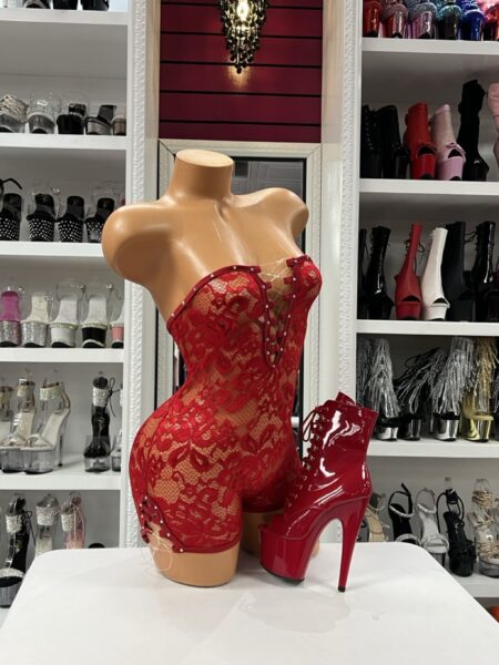 Red lace up romper with strapless design and fitted shorts