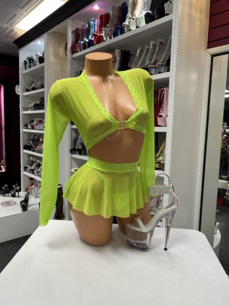 Neon green skirt set with long sleeve crop top and ruffled mini skirt