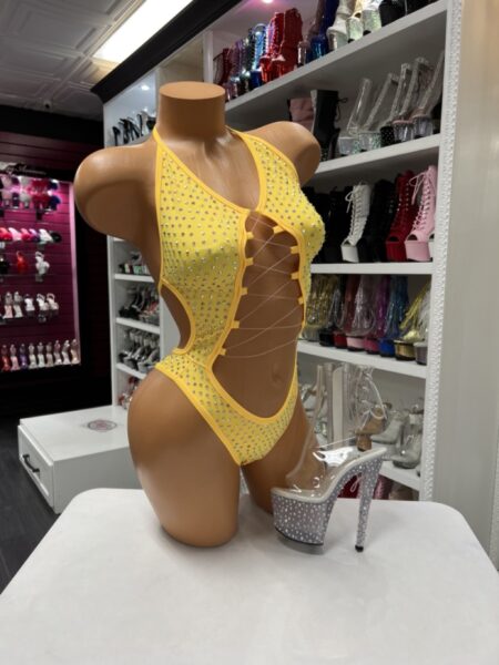 Yellow rhinestone cutout bodysuit with halter neckline and lace-up front