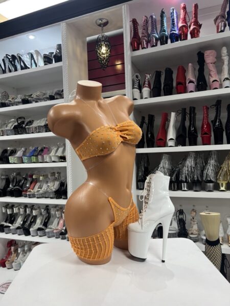 Orange rhinestone bikini set with strapless bandeau top and matching fishnet shorts