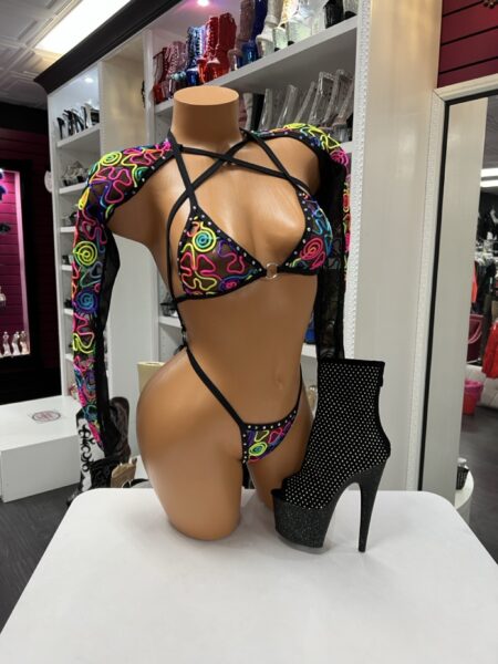 Neon swirl micro bikini set with strappy harness design and matching long sleeve shrug