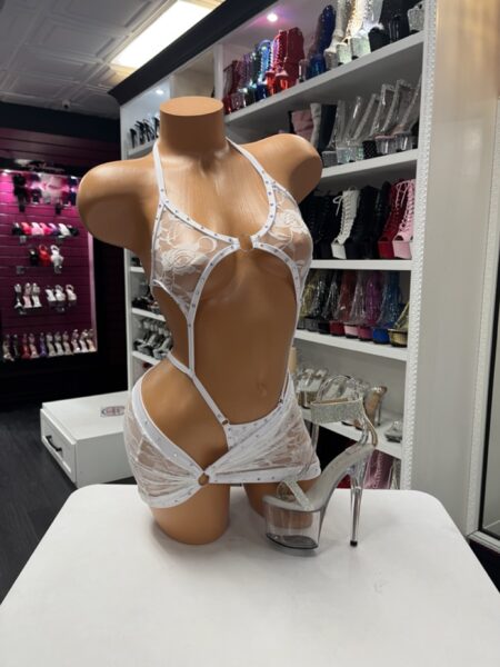 White lace rhinestone romper with cutout design and matching mini skirt overlay